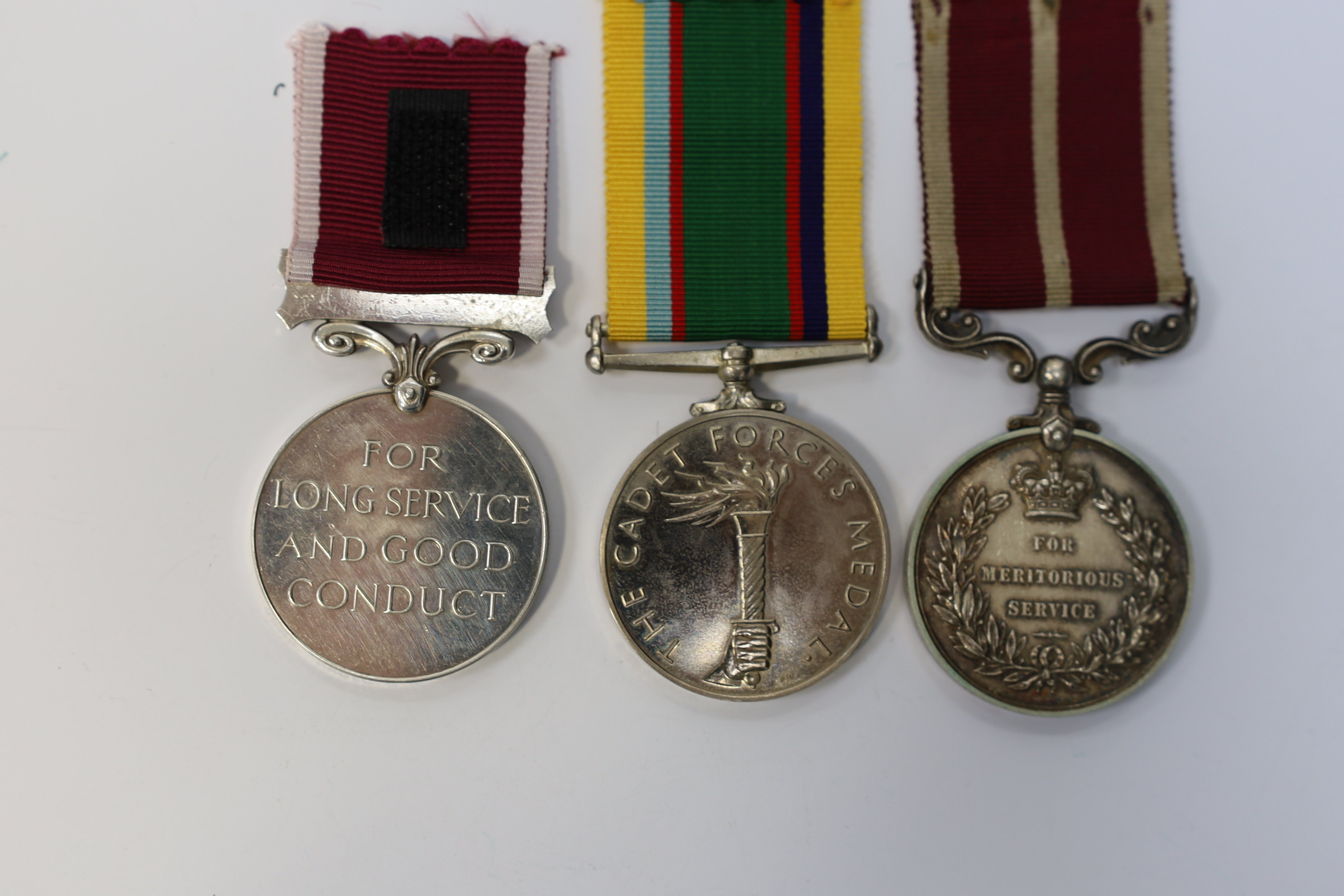 Three assorted service medals; GVI (D) Army Meritorious Service medal to Sjt A.Matheson.R.A.; ERII (A) Army LSGC to 23948816 Sgt M O Digan RAMC; ERII (A) Cadet Forces medal to Sqn.Ldr.J.R.Allen RAFVR(T). Condition - fair